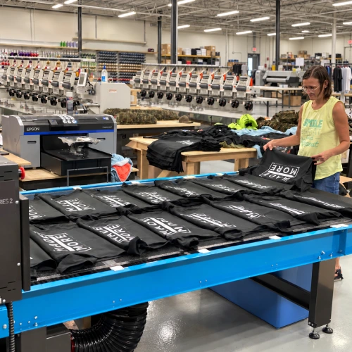 Custom apparel printing in production at The Printing Company